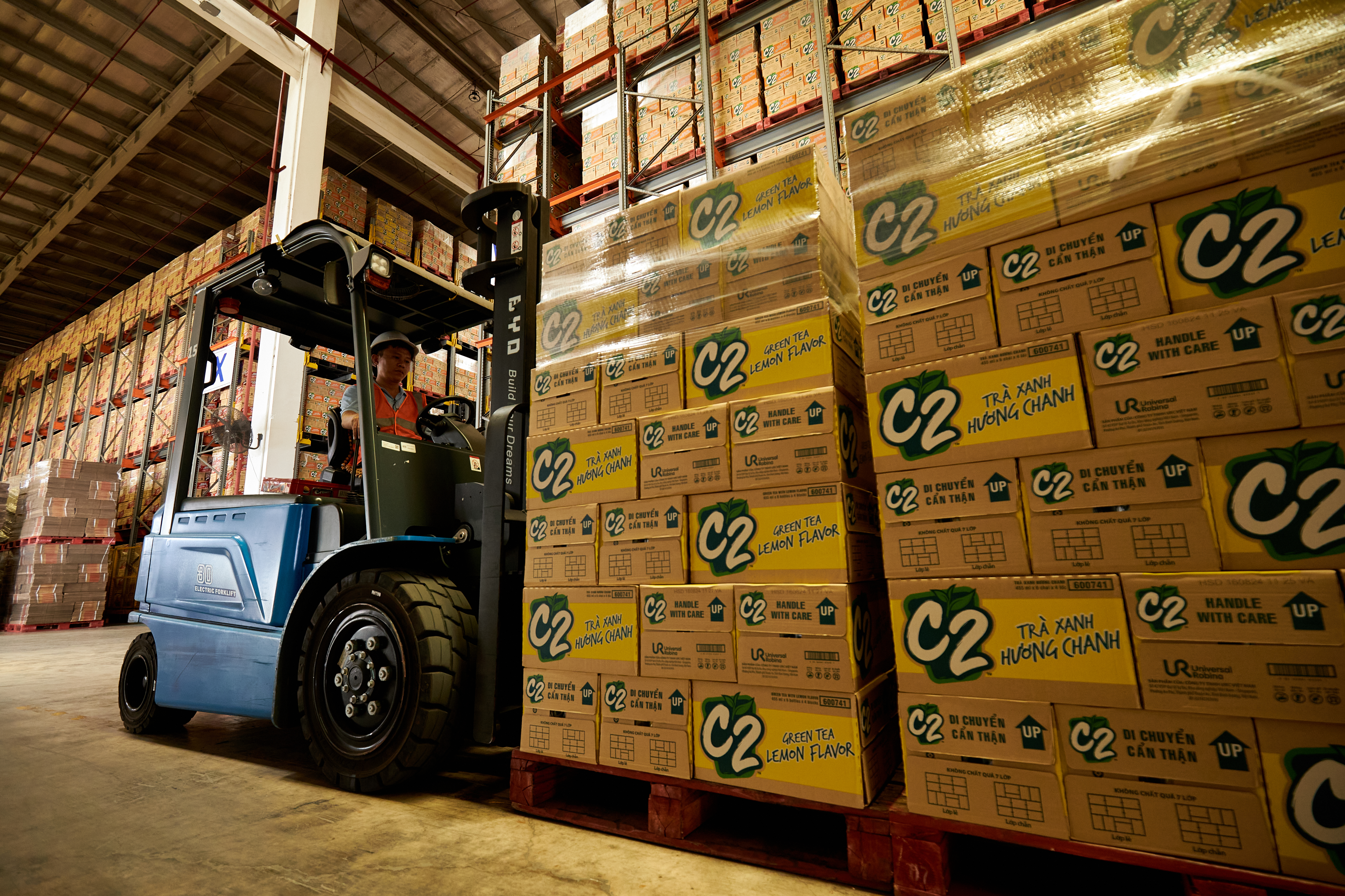 A forklift in a warehouseDescription automatically generated